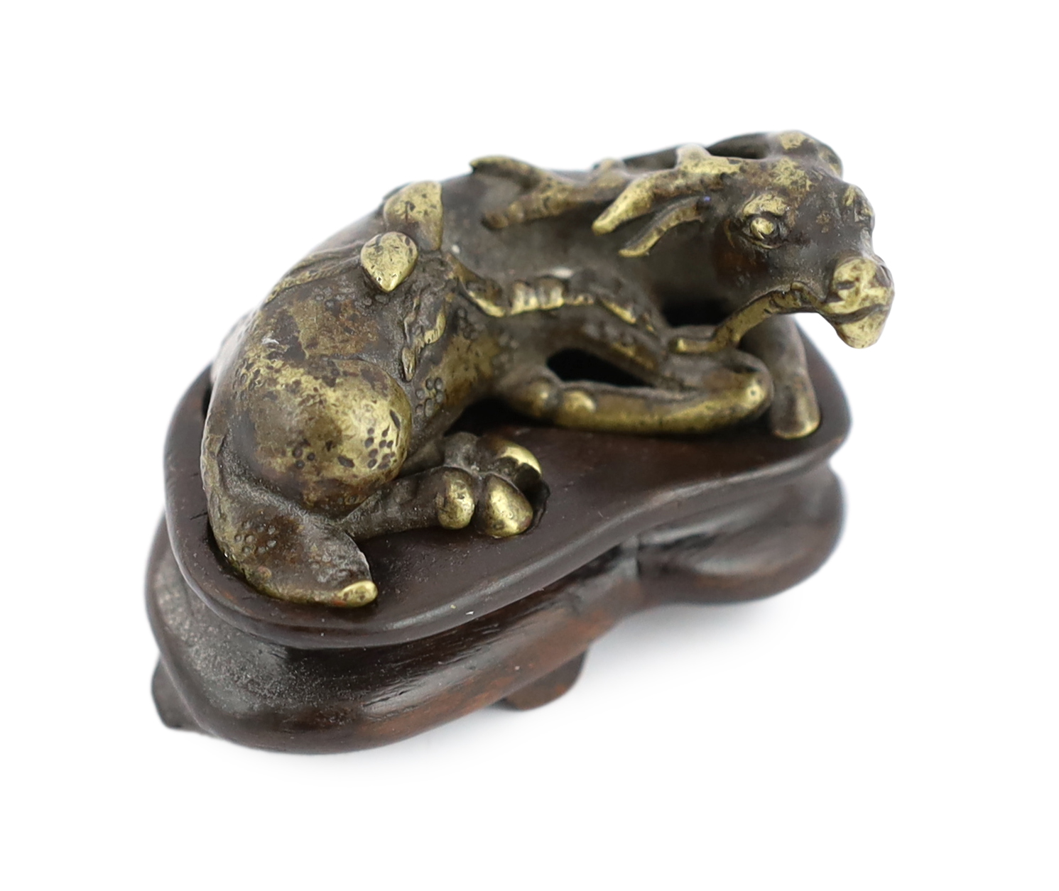 A Chinese bronze weight, in the form of a recumbent deer, late Ming/early Qing dynasty